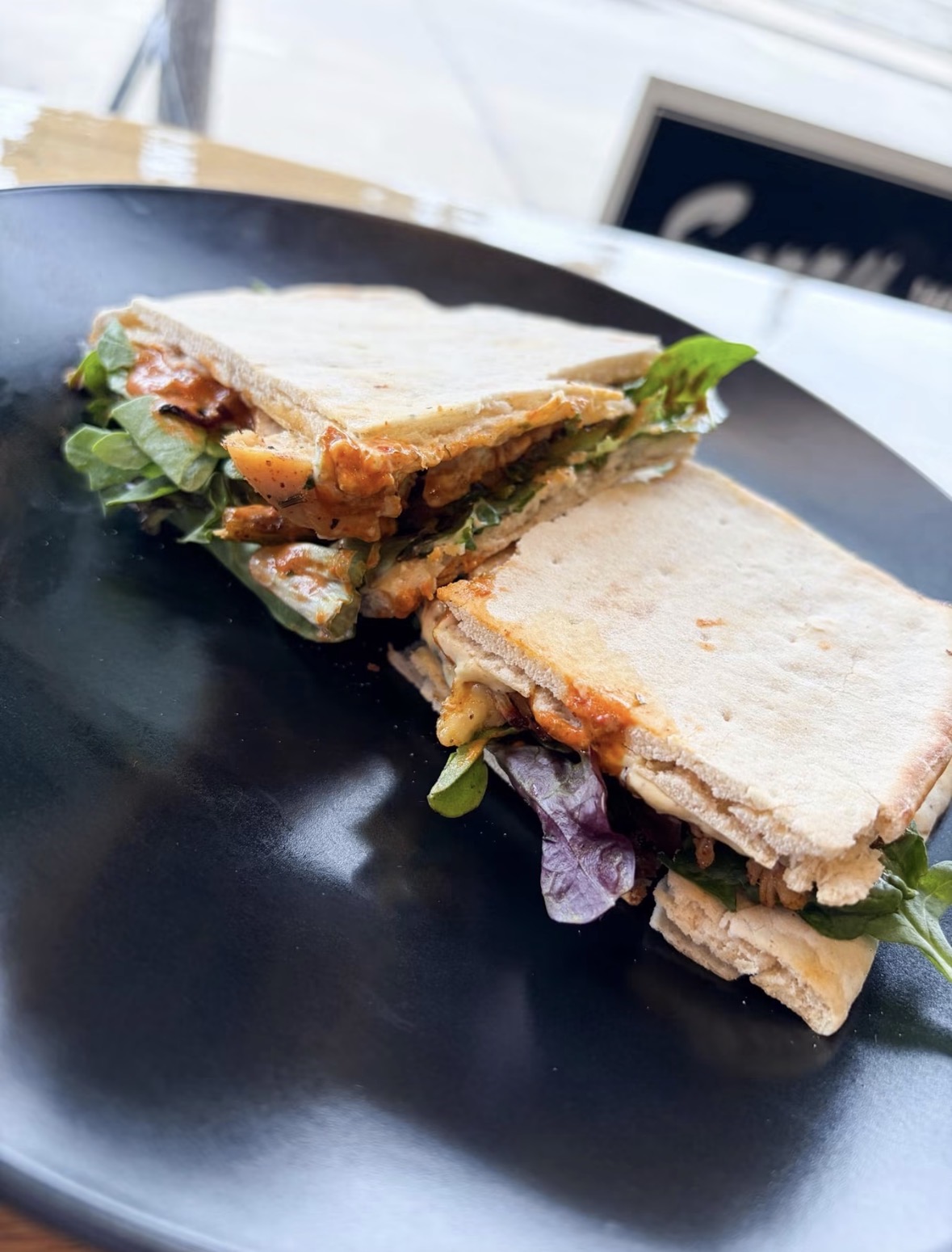 Pressed sandwich on a black plate